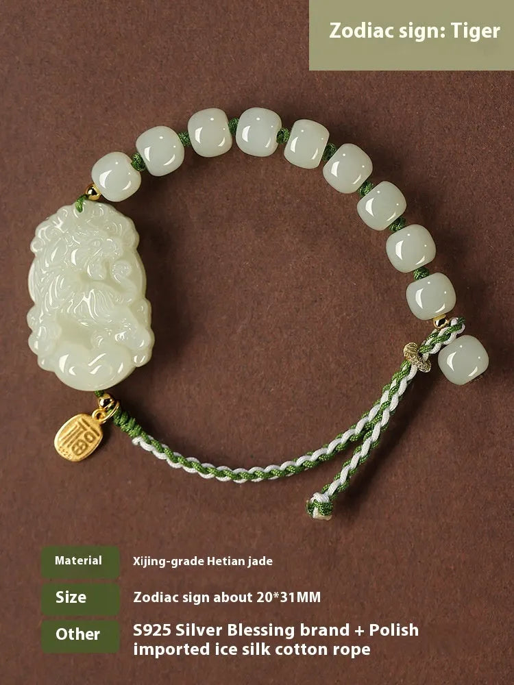 Rabbit Chinese zodiac bracelet with Hetian jade charm and silver card on a red rope.