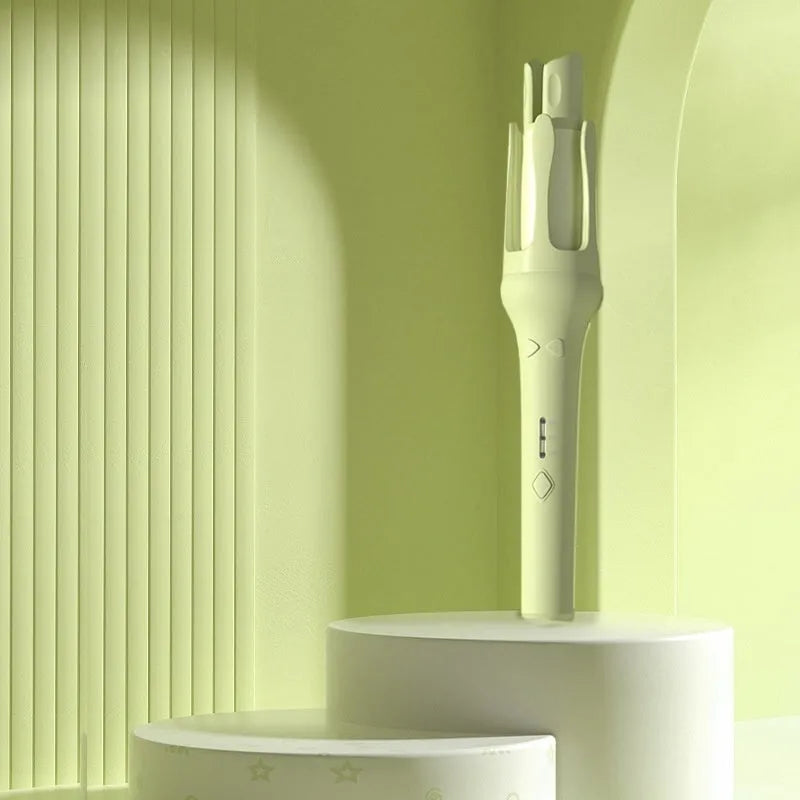 Automatic hair curler with a 32mm barrel in a two-tone colour option, shown with a plug adapter.