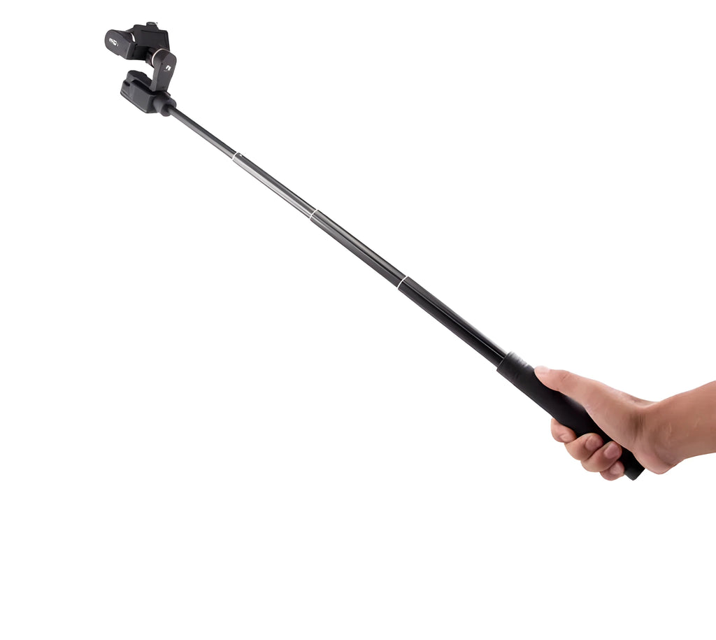 Black retractable selfie stick extended to full length with phone attached, showing detachable tripod legs and wireless remote.