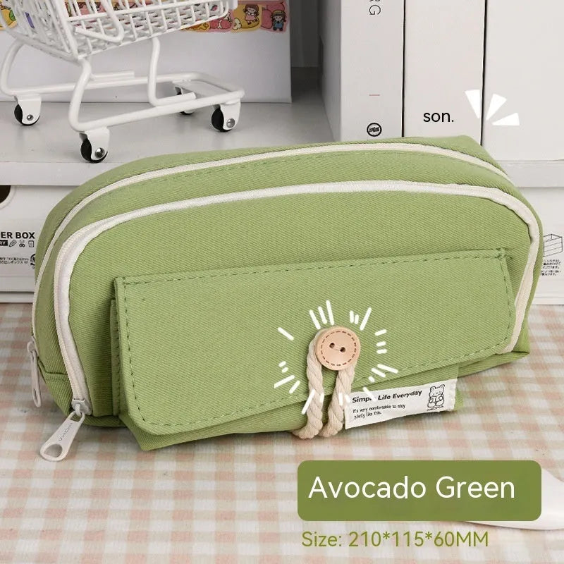 Large capacity canvas pencil case for girls in beige, blue, gray, or green, holding many pens.