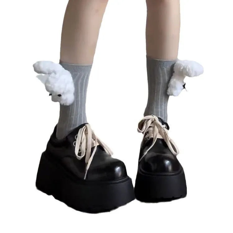 Matte black women's lace-up leather shoes with a thick sole and a chunky heel.