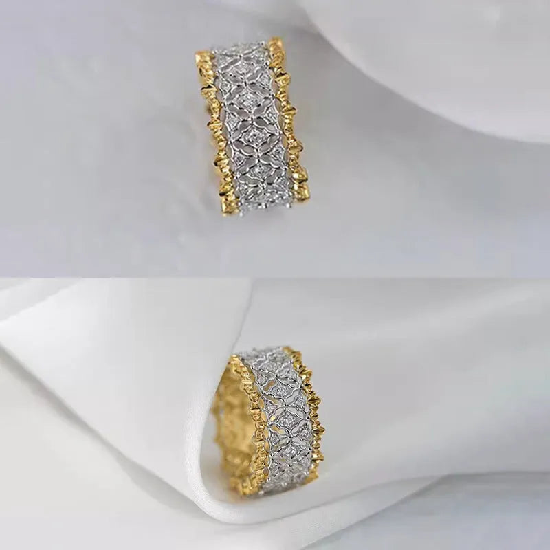 Gold two-tone geometric women's zircon ring on a plain background, showing its round stone and copper construction.