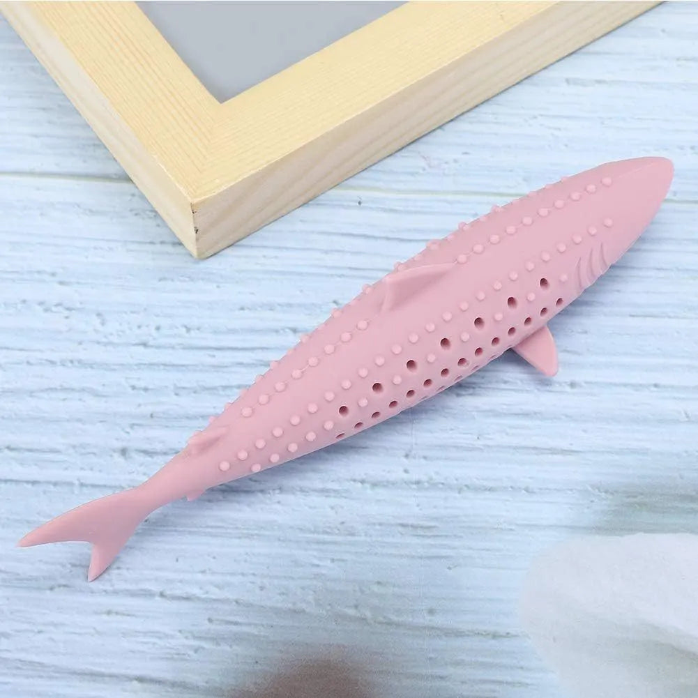 Green silicone fish-shaped chew toy for cats on a white background, showing breathable side holes.