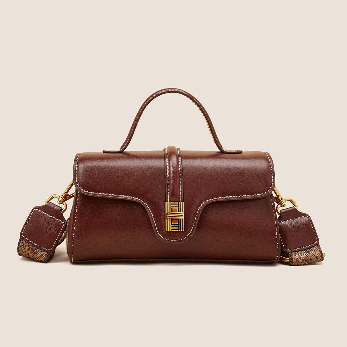 Cambridge-style leather messenger bag in clamshell design with lock detail and internal compartments