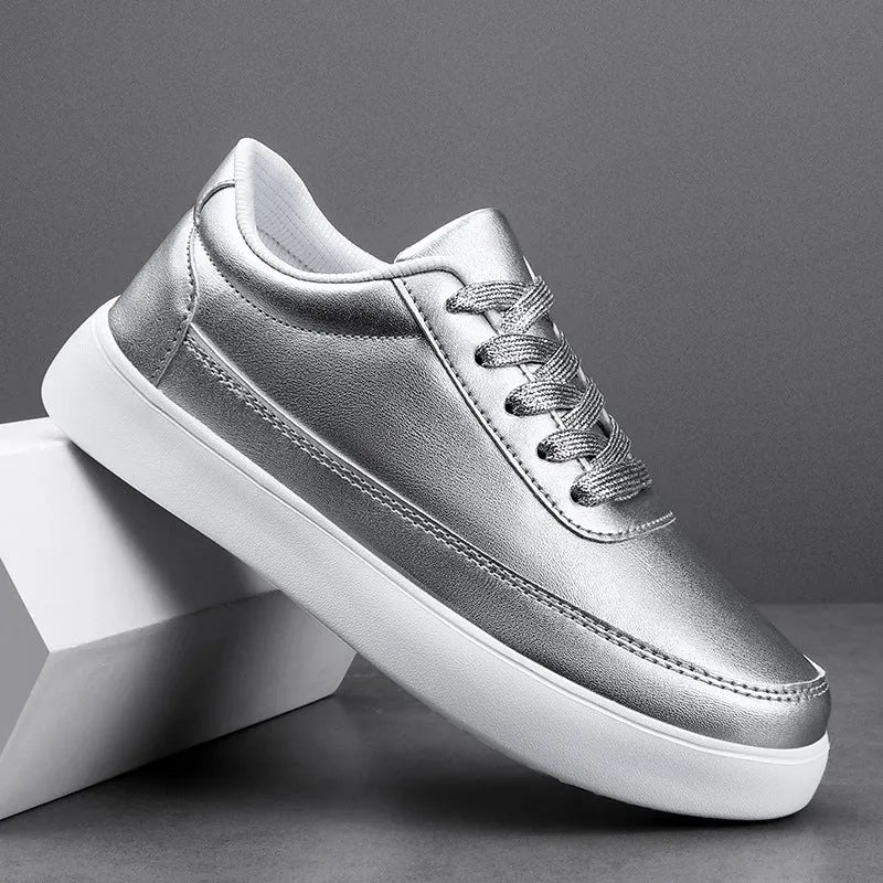 Women's gold leather lace-up flat casual shoes on a white background.