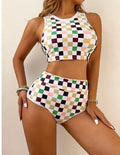 Women's backless racing one-piece swimsuit with suspenders in a black and white chessboard pattern.