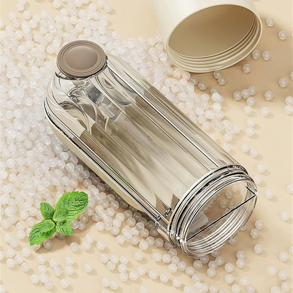 Beige collapsible dog water bottle with food container at base, showing press dispenser and tray.