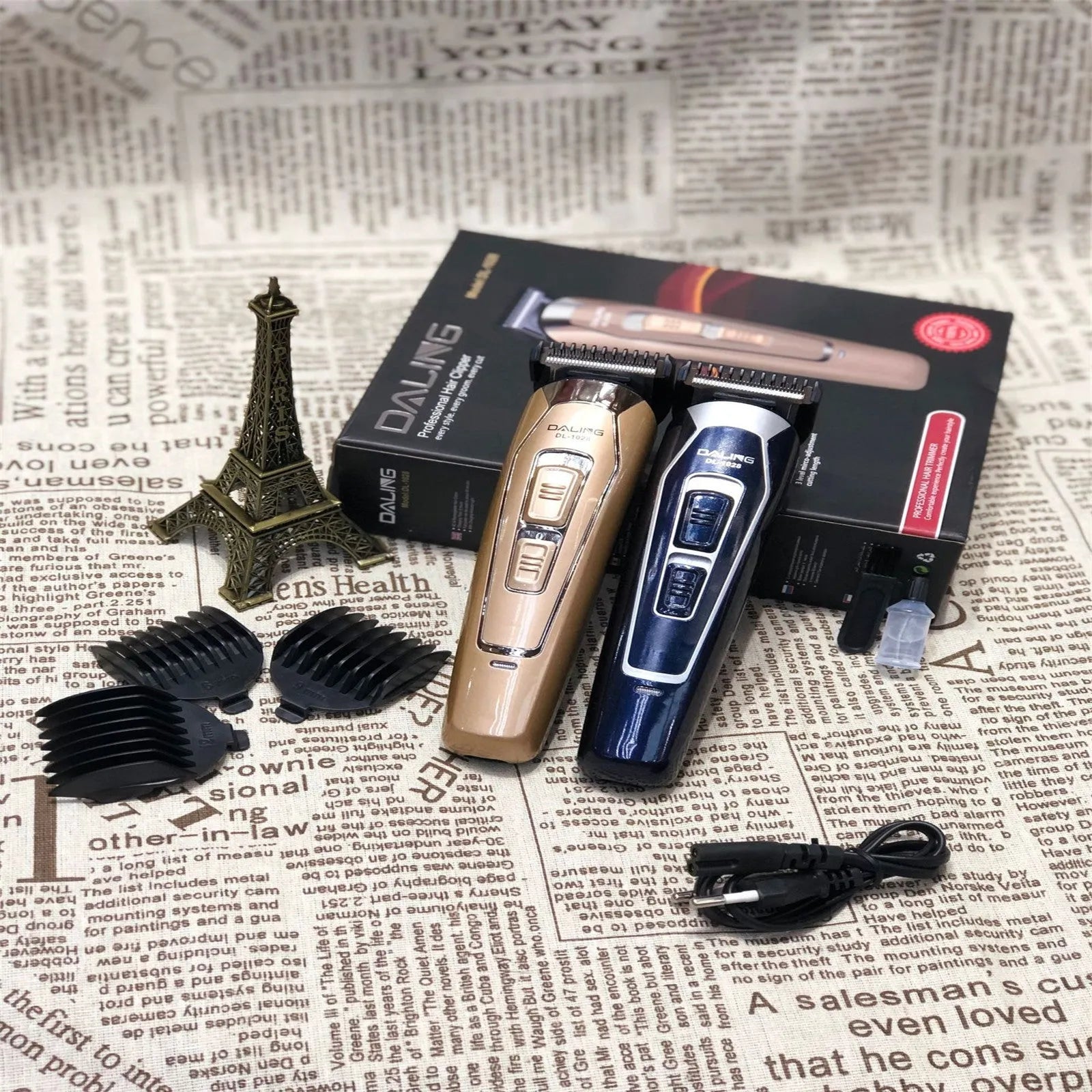 Dark blue cordless rechargeable electric hair clipper with stainless steel blades on a white background.