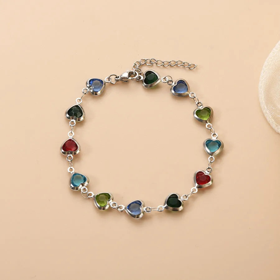 Geometry heart bracelet with devil's eye design in stainless steel showing six colour options