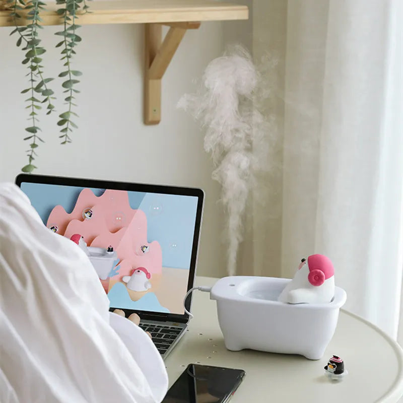 White USB air humidifier and aromatherapy diffuser with 550ml water tank on a desk