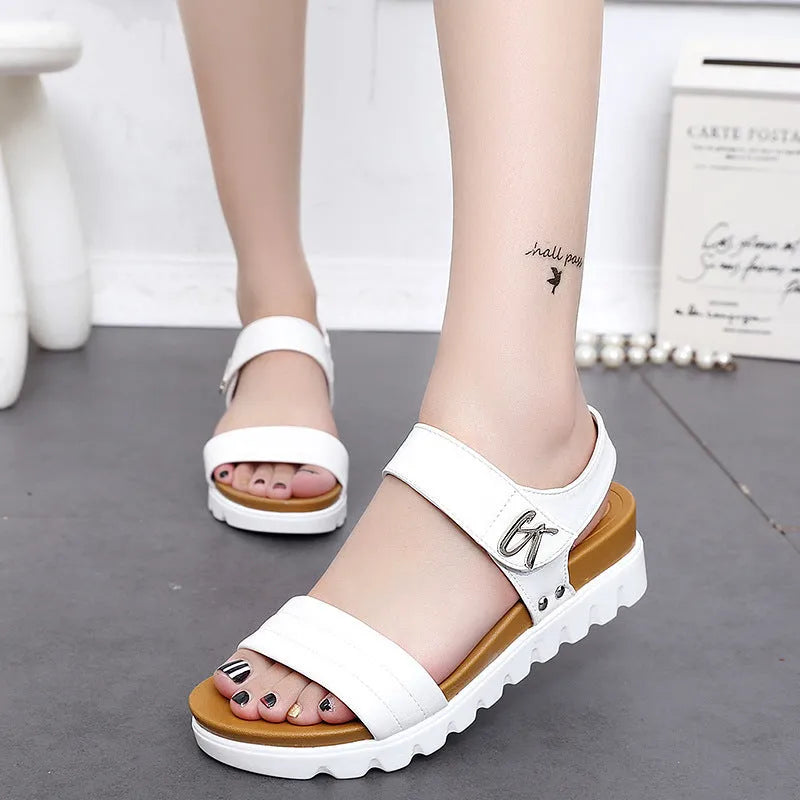 Women's white fish mouth wedge heel sandals with ankle strap on beach