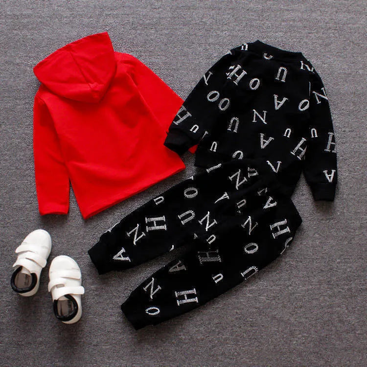 Red and white children's long sleeve two-piece clothing set made from polyester and vinylon fabric.