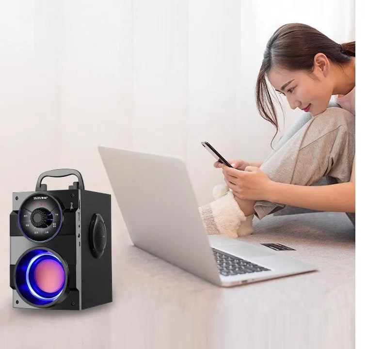 Black portable mini home audio system with subwoofer and 3.5mm audio cable