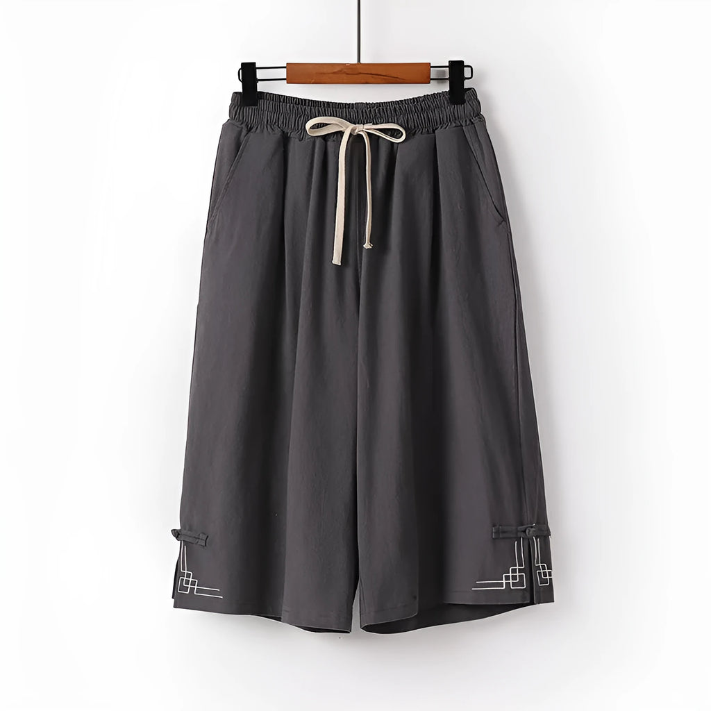 Apricot wide leg cotton leisure shorts with embroidery detail on a mid waist.