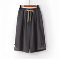 Apricot wide leg cotton leisure shorts with embroidery detail on a mid waist.