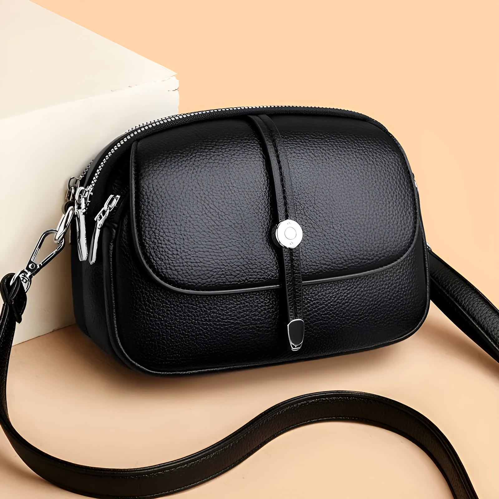 Soft PU oval-shaped women's crossbody shoulder bag in dark brown with sewing thread details.