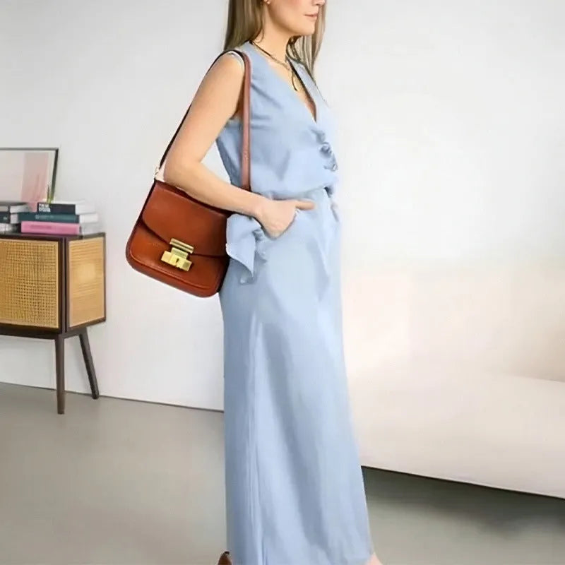 Women's blue sleeveless vest and long skirt two-piece casual co-ord set on a hanger.