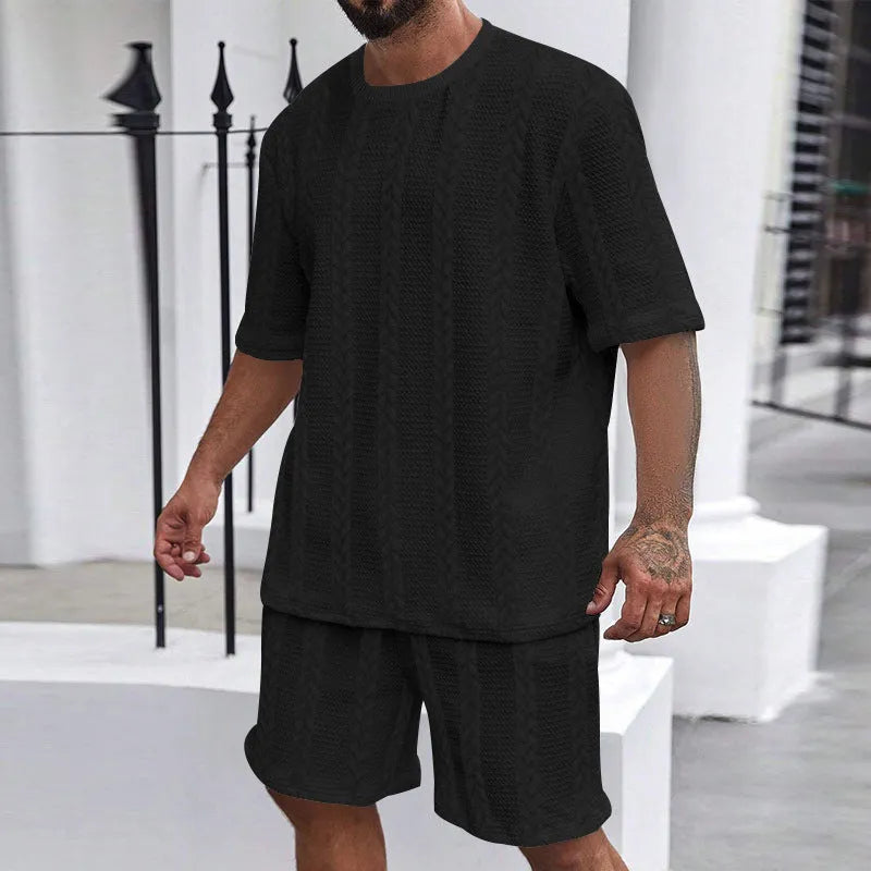 Men's knitted jacquard short sleeve pullover and shorts set in a solid colour on a hanger.