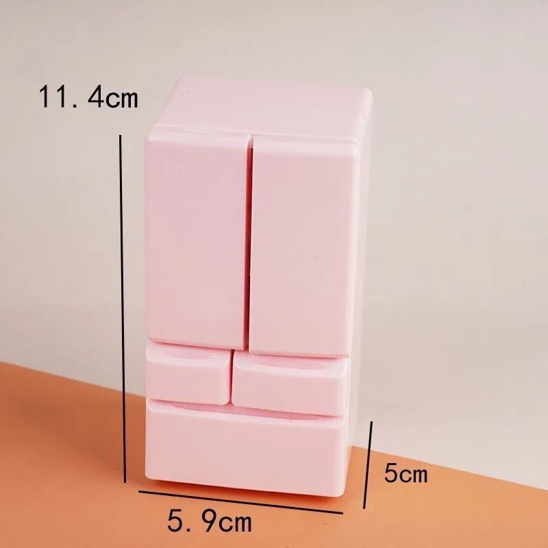 White plastic miniature candy toy model with light-up feature on display.