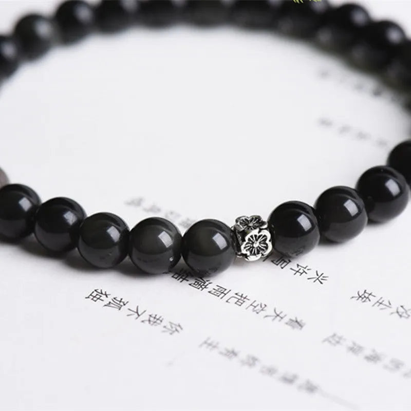 Natural obsidian bracelet with S925 silver flower charm and dragon phoenix constellation design
