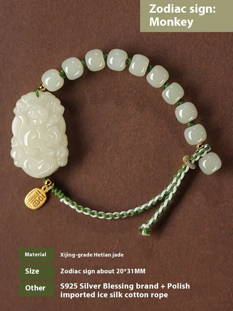 Rabbit Chinese zodiac bracelet with Hetian jade charm and silver card on a red rope.