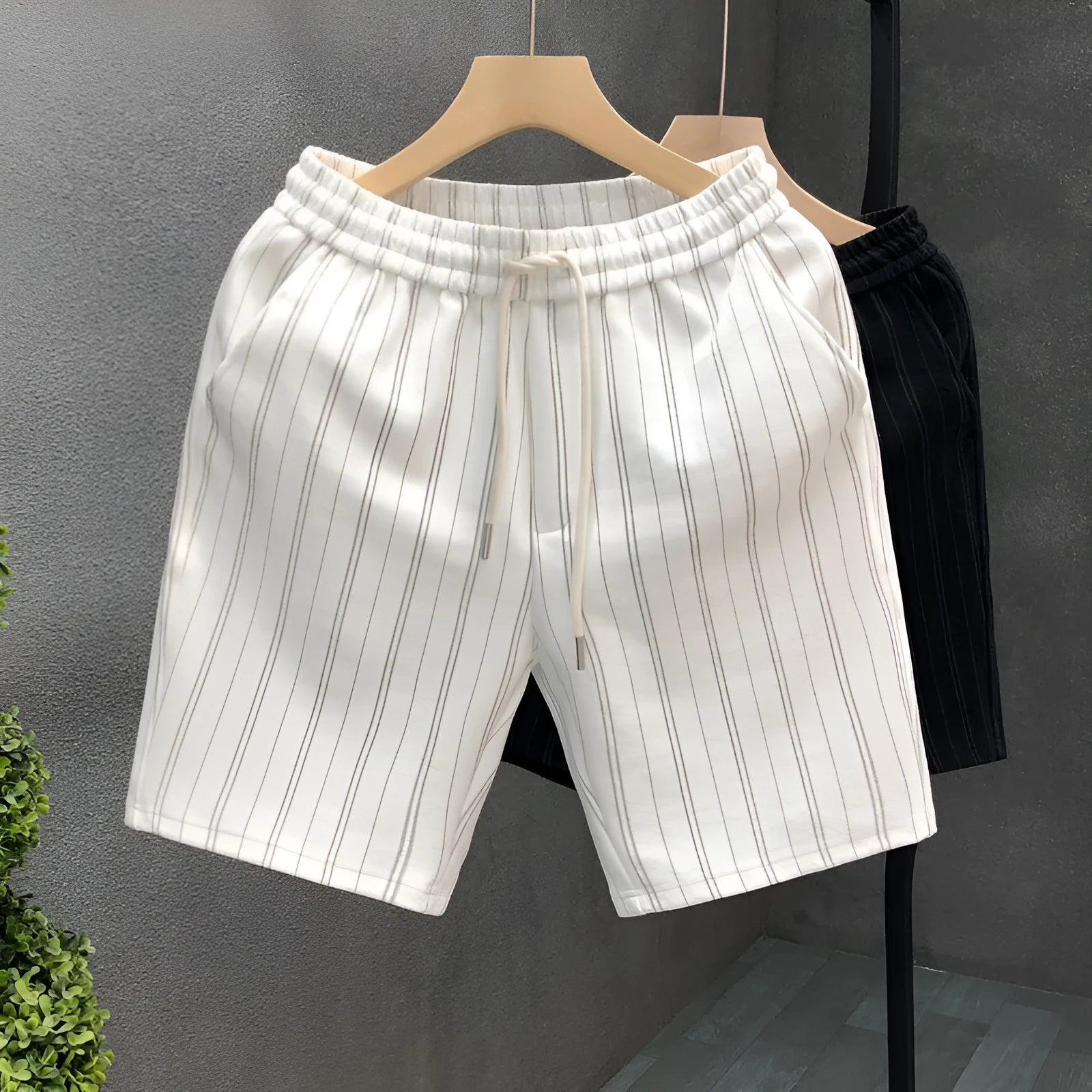 Men's black and white striped fleece-lined casual shorts with straight leg and ankle banded design
