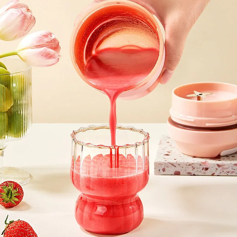 Grape purple portable rechargeable blender cup with lid, 400ml capacity, shown with USB cable.