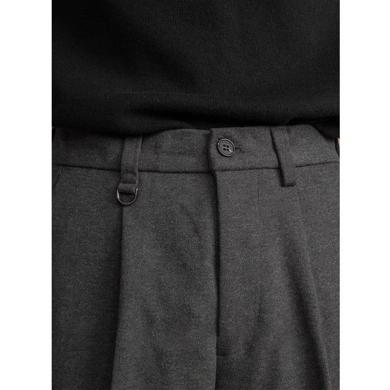 Man wearing straight leg grey suit pants for business casual attire.