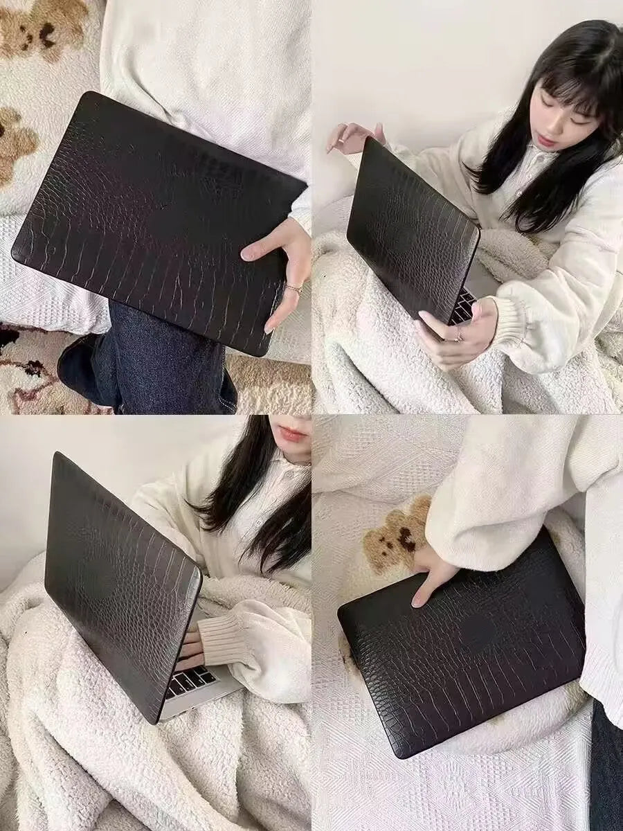 MacBook protective case with crocodile pattern texture and hollowed-out Apple logo design in black colour