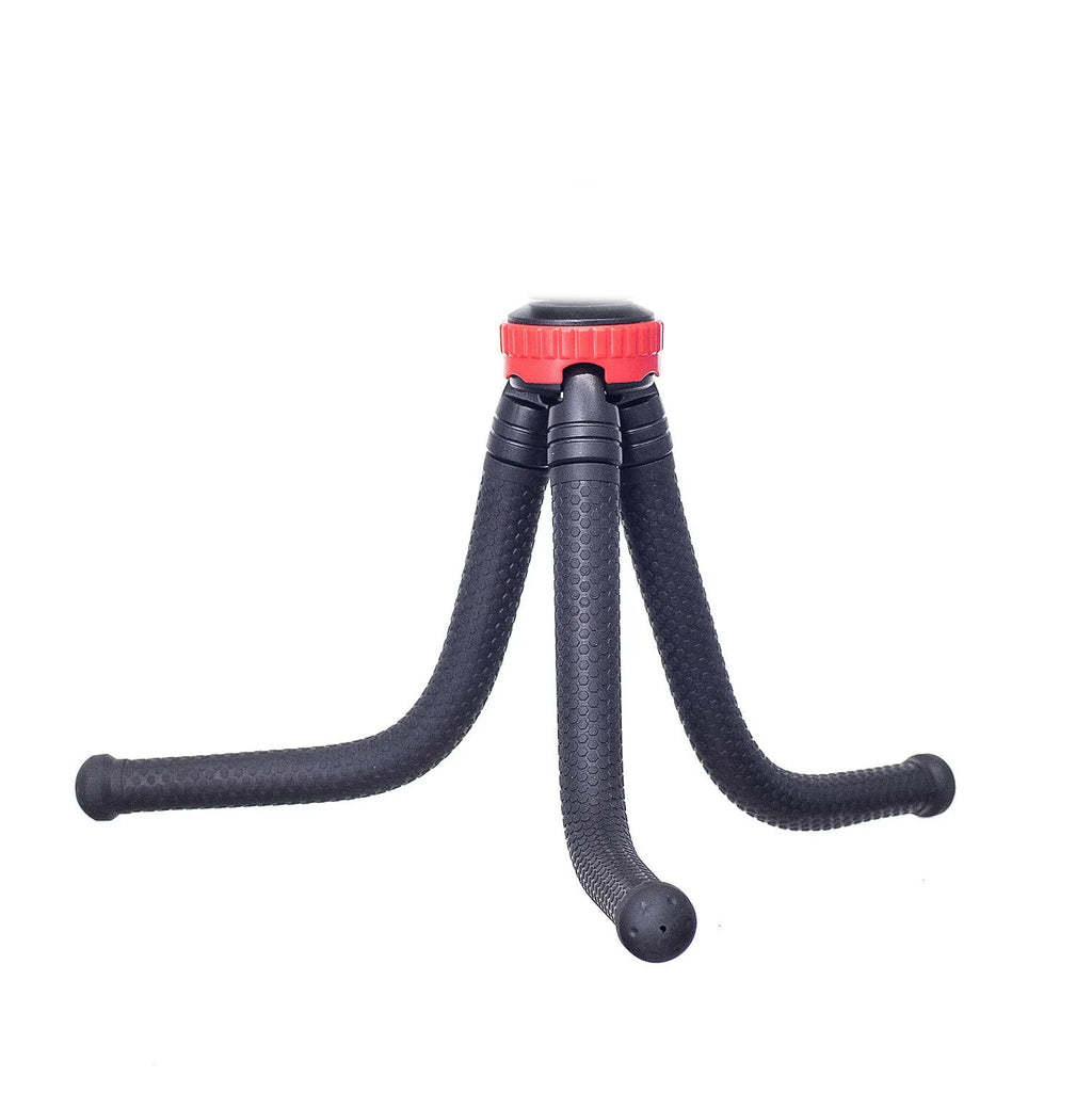 Black octopus tripod with spherical gimbal head wrapped around pole supporting mobile phone