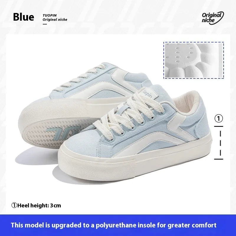 Women's low-top lace-up board shoes in blue, with a vulcanised rubber sole and round toe.