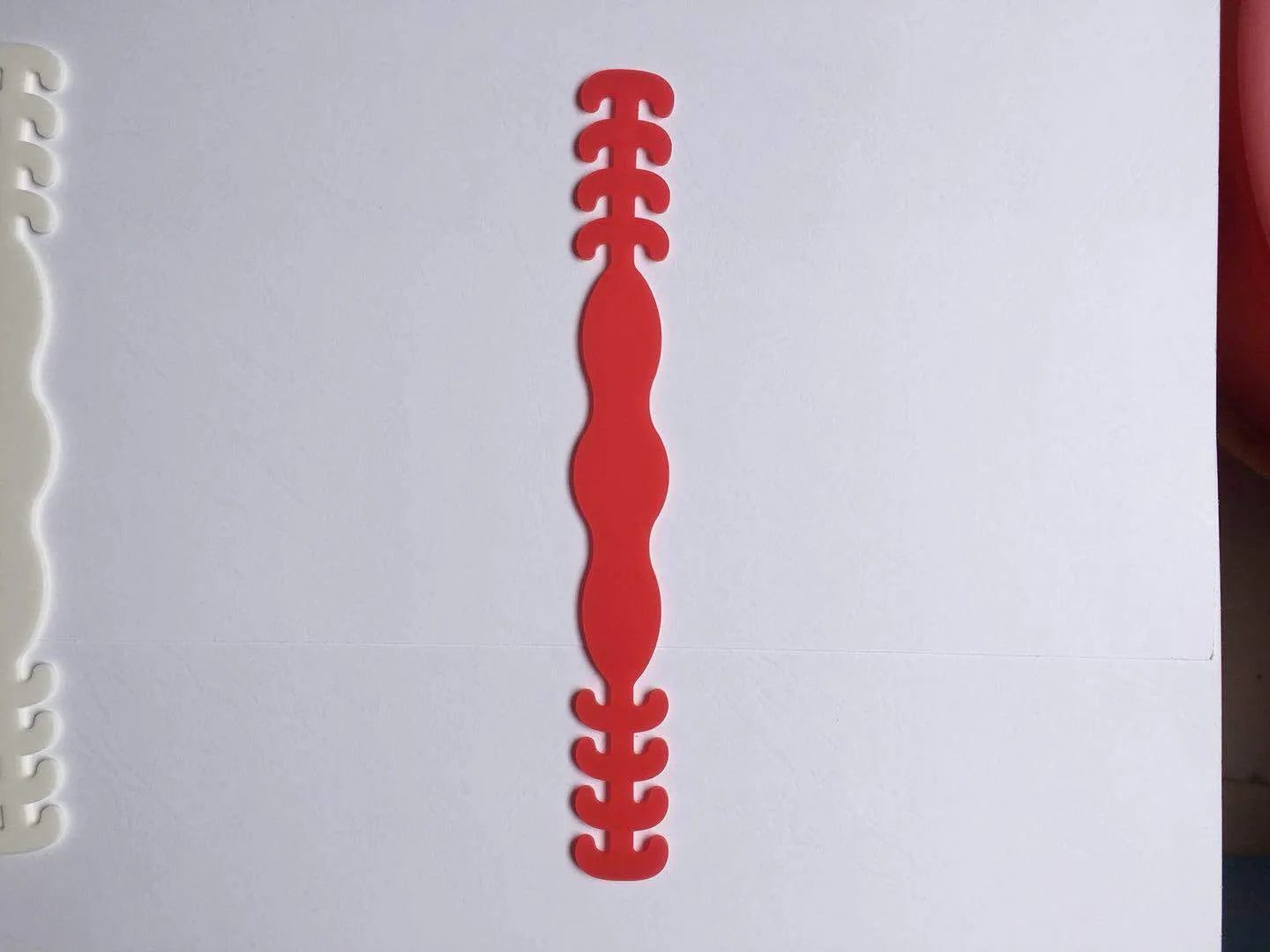 Eight silicone protective buckles in different colours for cable organisation