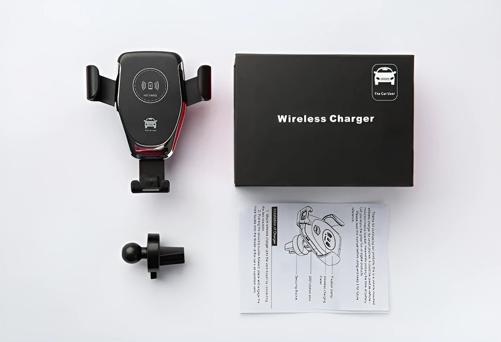 Black car wireless charger mounted on vent, holding iPhone with automatic support arms visible