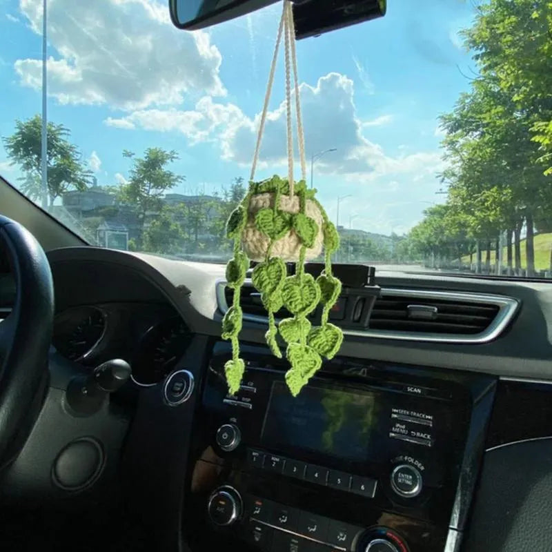 Green and white knitted wool car plant decoration with 8cm base and hanging rope.