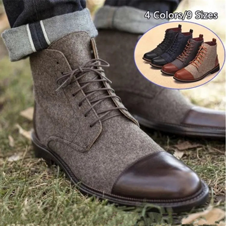 Men's black leather motorcycle-style ankle boots with belt buckle detail on the side.