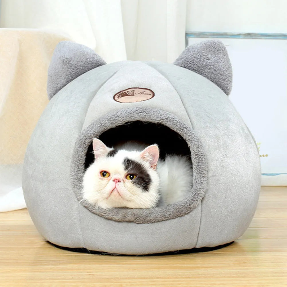 Large grey enclosed sofa-style winter nest cat bed for indoor cats, showing removable fleece lining.