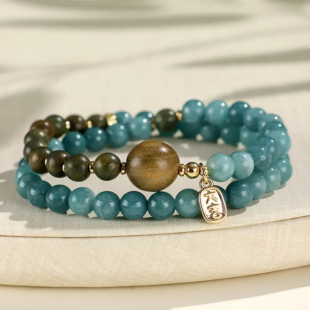 Women's blue gold sandalwood beaded bracelet with geometric design and Fu character, New Chinese style.