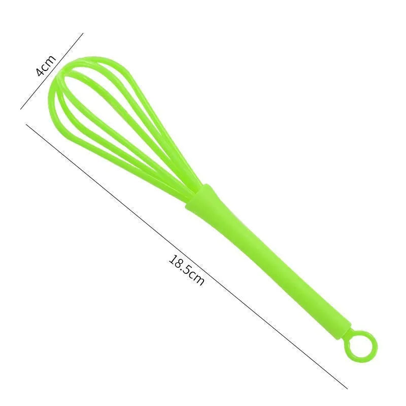 Plastic creative mini manual eggbeater in green and yellow, size 4x18.5 cm, on kitchen counter