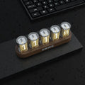 RGB LED digital tube clock showing time display with colourful lighting on desktop
