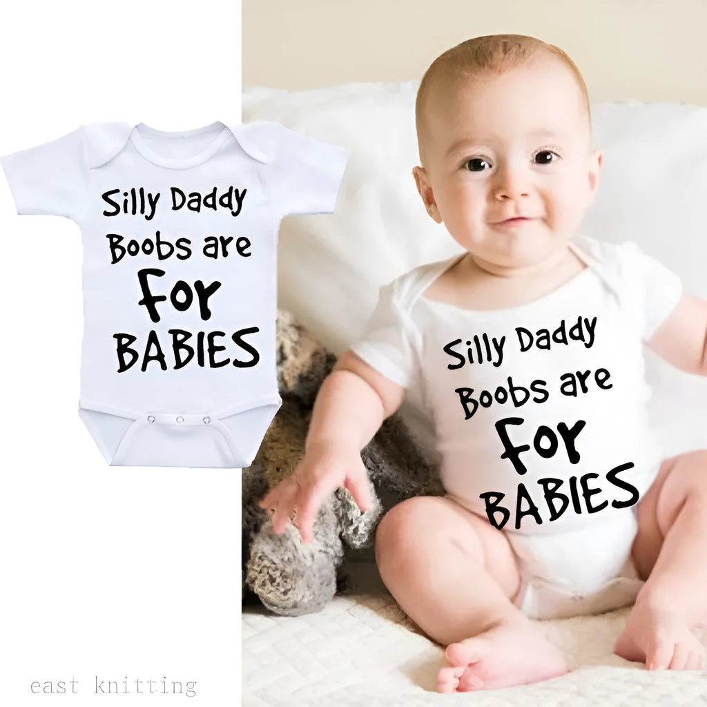 White triangle climbing baby bodysuit with black text reading 'Silly Daddy Boobs Are For Babies'