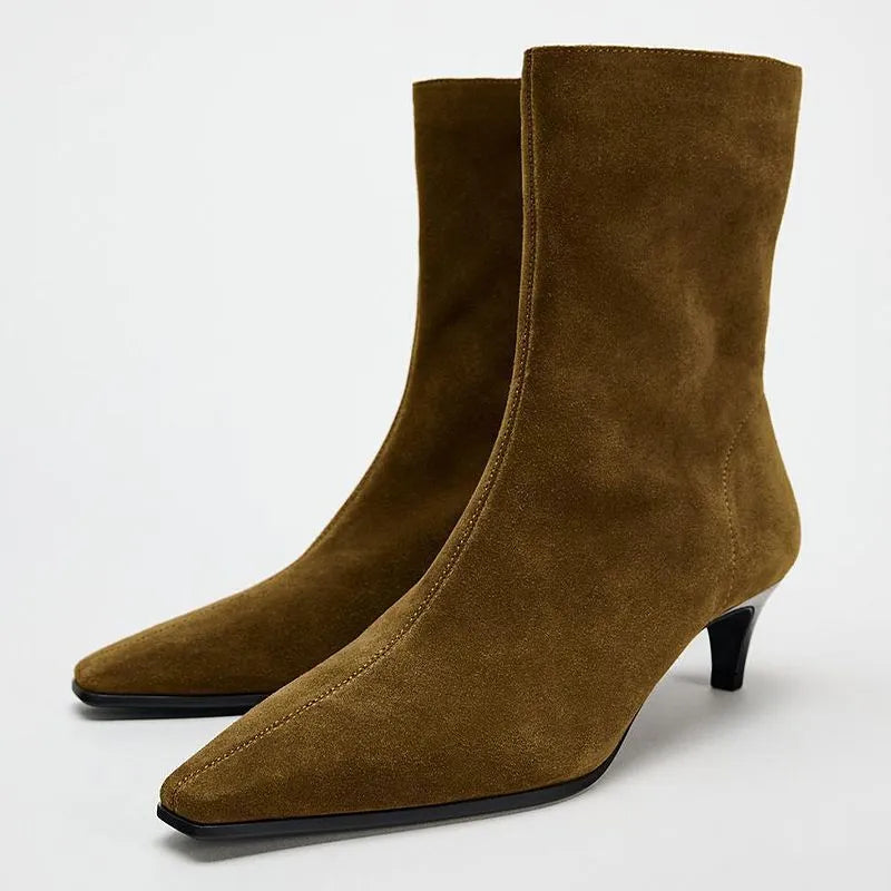 Brown square toe ankle boot with side zipper and a low kitten heel on a waterproof platform sole.