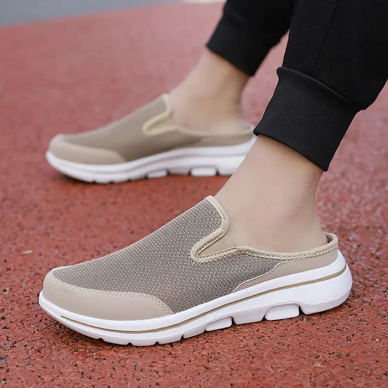 Women's light grey mesh toe holder slippers with a flat sole on a white background.