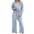Women's solid colour knitted jacquard sweater and cropped pants suit in a geometric pattern.