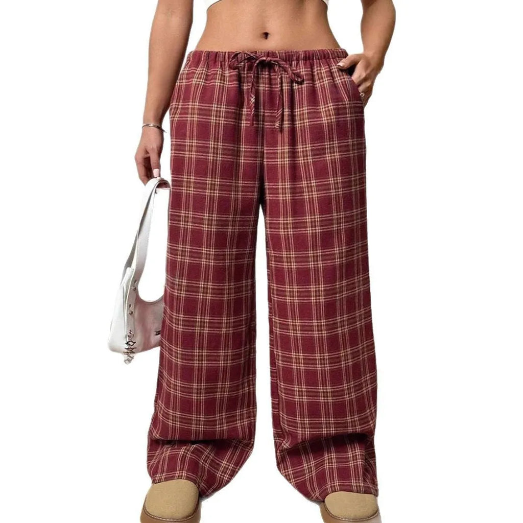 Women's loose plaid trousers with drawstring waist and side pockets in red or blue colour options