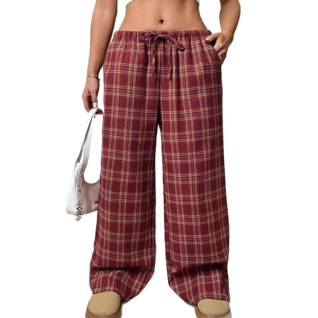 Women's loose plaid trousers with drawstring waist and side pockets in red or blue colour options