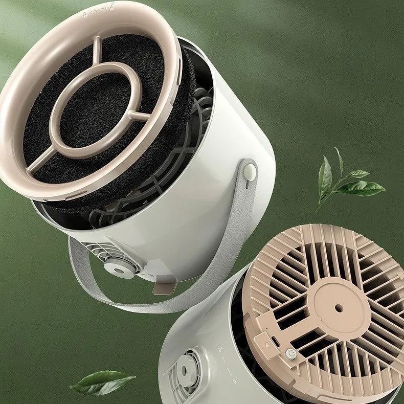 Milk white portable desktop exhaust fan with USB cable and removable filter on a kitchen countertop
