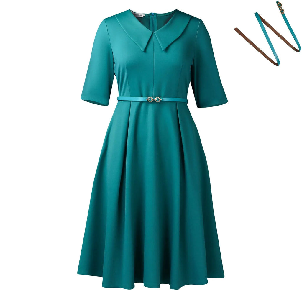 Solid colour African dress with half sleeves and a matching belt, shown on a hanger.
