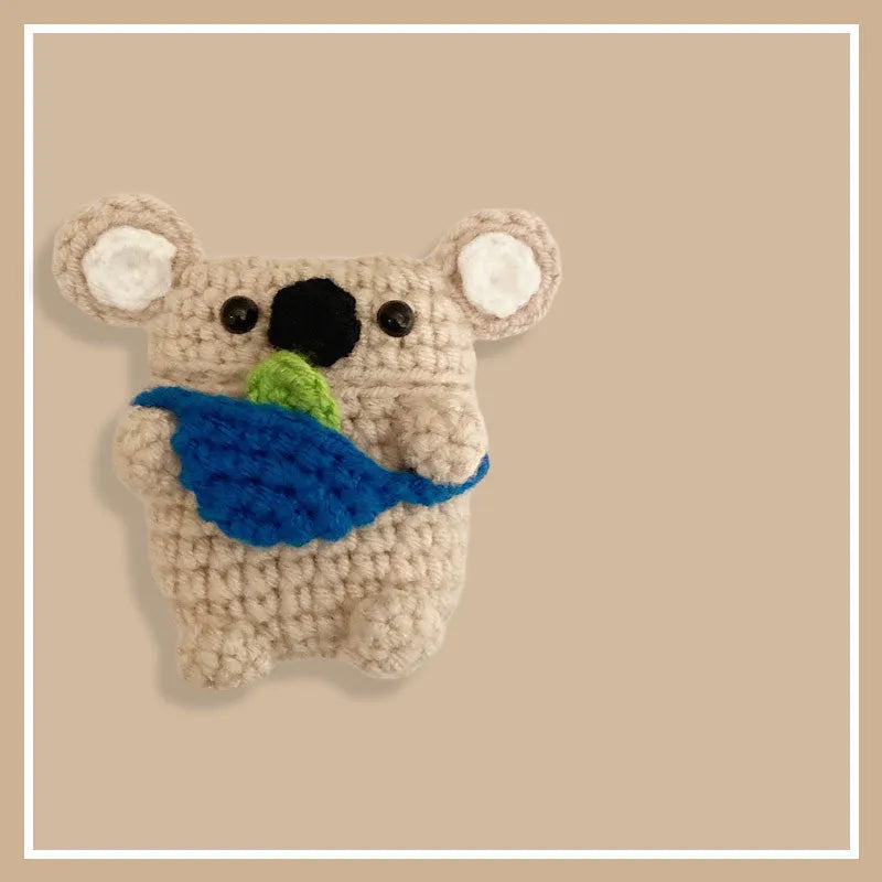 Handmade knitted grey koala bear backpack design cover on an Apple AirPods Pro charging case.