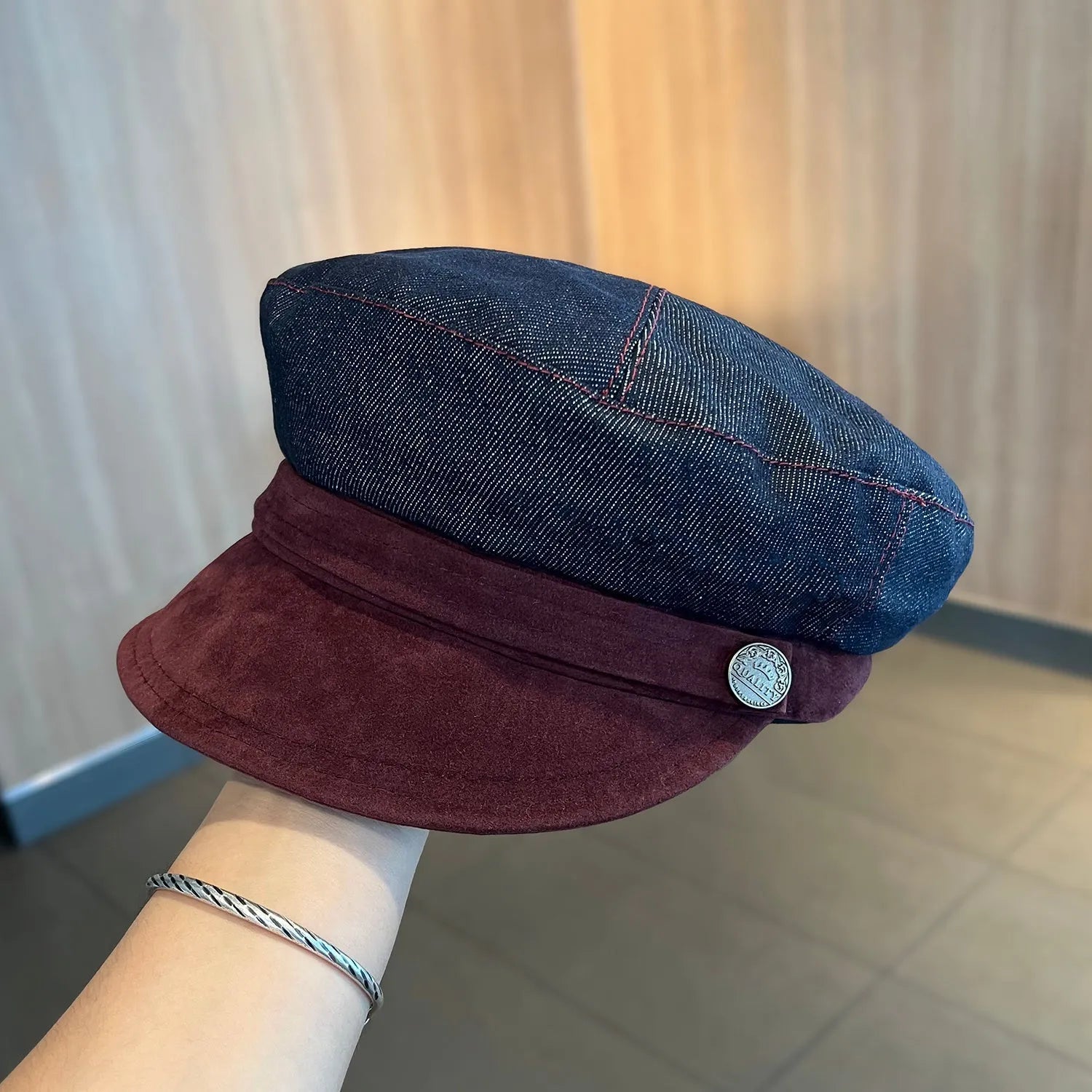 Dark blue denim octagonal newsboy hat with an adjustable fit for 54-58cm head sizes.