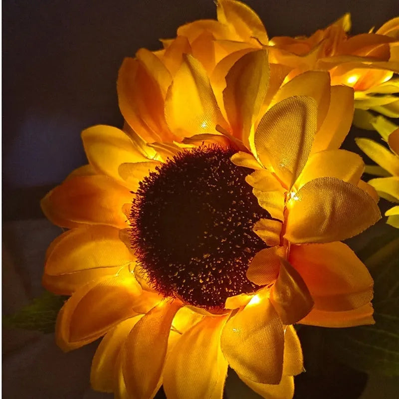 Rechargeable sunflower LED night light with artificial flower design on table